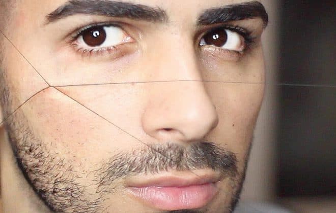 Man getting eyebrows threaded